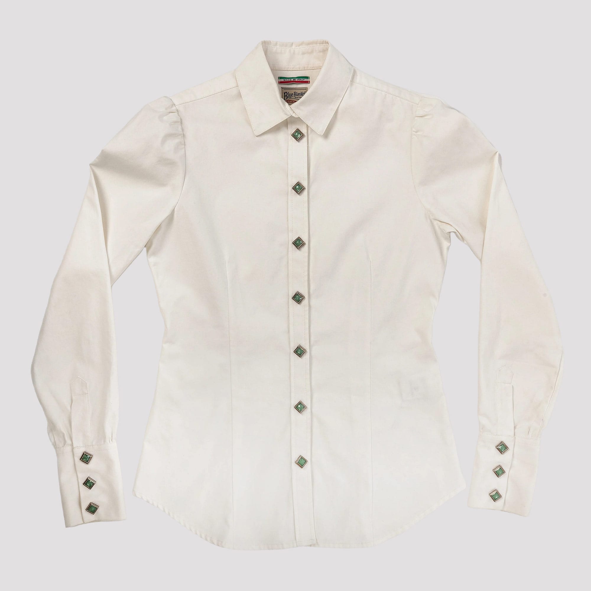 White shirt with decorative buttons on a light gray background